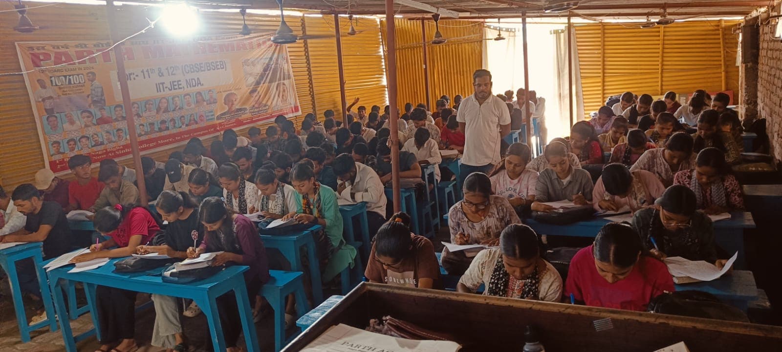 A full batch of Parth Academy students taking a weekly full-syllabus test